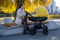 Універсальна всесезонна дитяча коляска 2в1 "Discovery" з сумкою дощовиком і сіткою / жовта